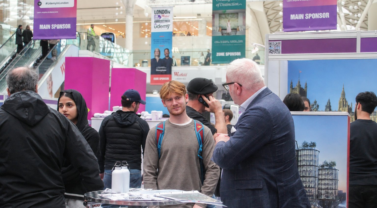 An employer and candidate in conversation at a stand at the London Job Show