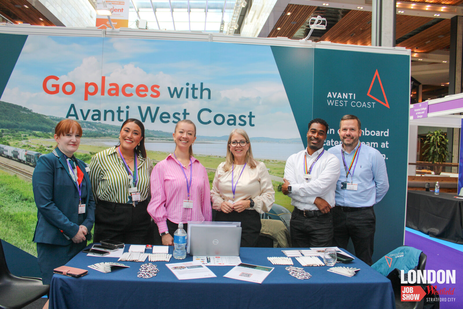 An employer meeting candidates at their stand at the London Job Show