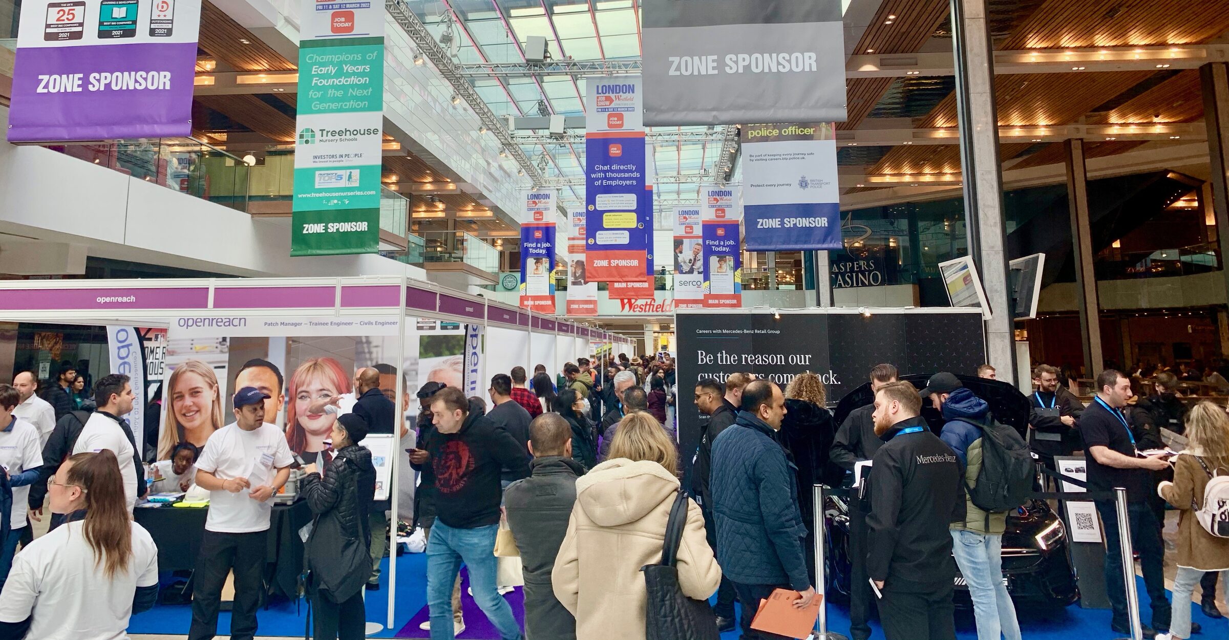 A busy London Job Show floor with employers recruiting at Westfield London